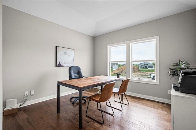 office space with wood-type flooring and vaulted ceiling