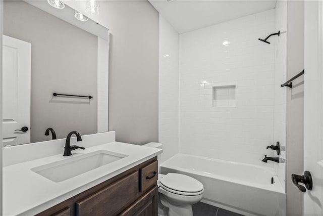 full bathroom with tile patterned floors, vanity, toilet, and tiled shower / bath