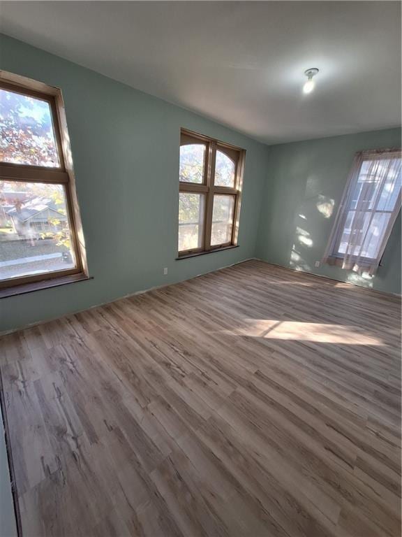 unfurnished living room featuring hardwood / wood-style flooring