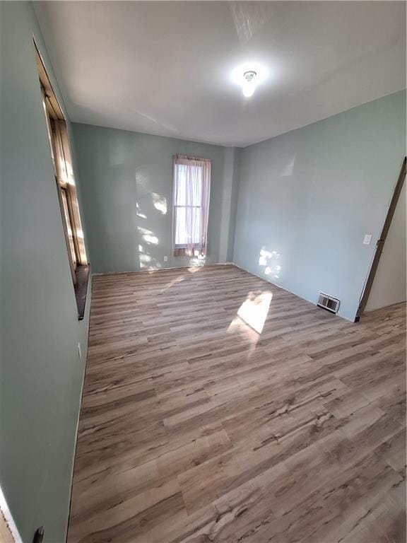 spare room with light hardwood / wood-style floors