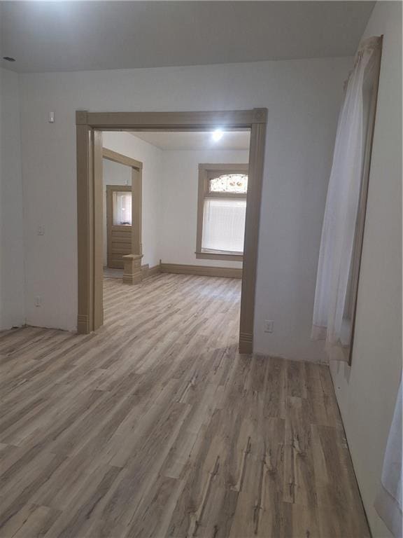 unfurnished room featuring light wood-type flooring