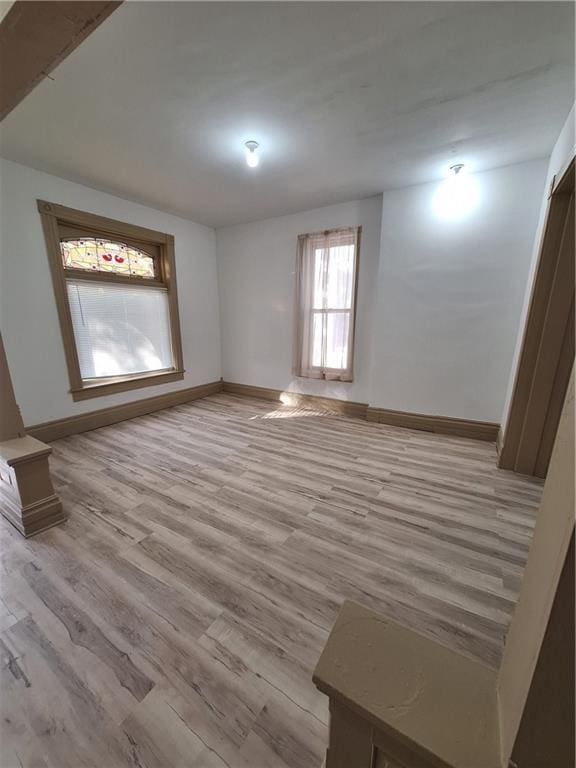 unfurnished room with light hardwood / wood-style floors