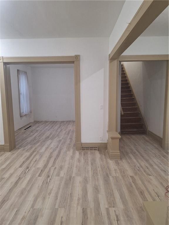 unfurnished living room featuring light wood-type flooring