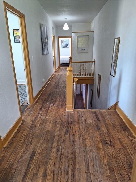 hall with dark hardwood / wood-style floors