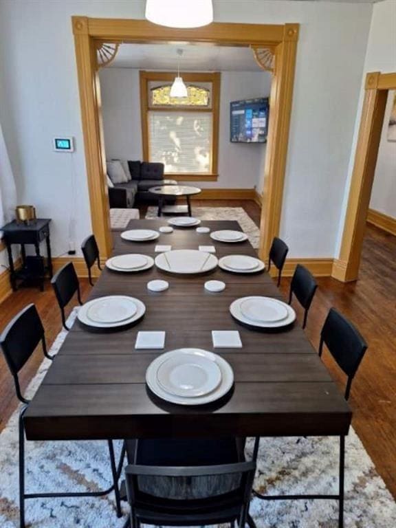 dining room with wood-type flooring