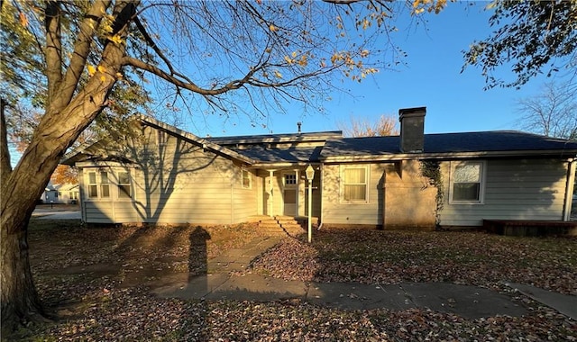 207 N Elm St, Coffeyville, KS 67337 - back of property with a chimney