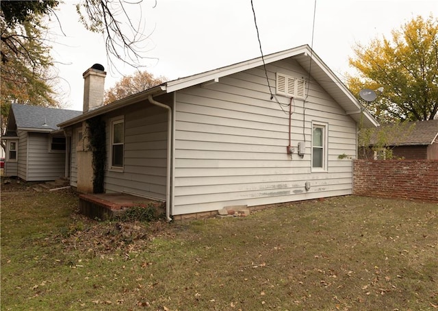 view of home's exterior featuring a lawn