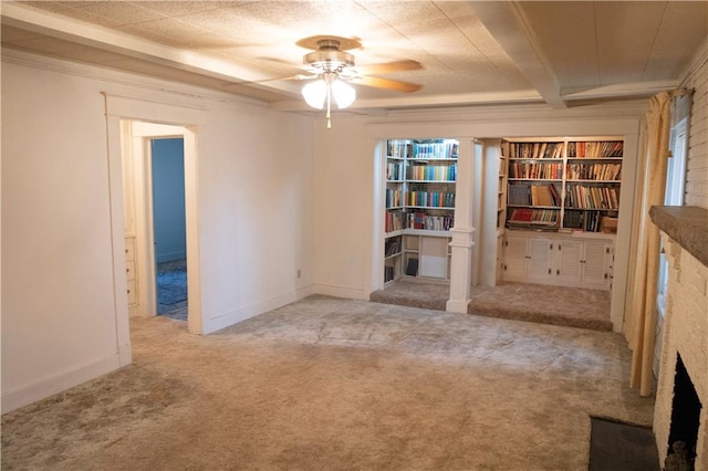 carpeted spare room with ceiling fan and ornamental molding