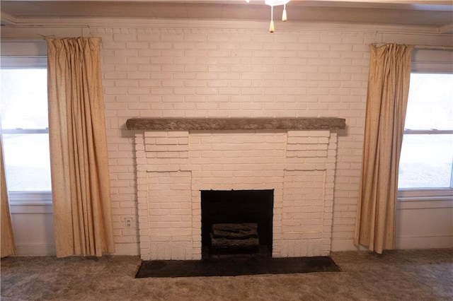 details with carpet, crown molding, and a fireplace