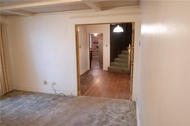 hall with hardwood / wood-style floors, crown molding, beamed ceiling, and coffered ceiling