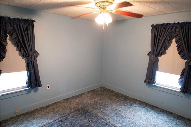 unfurnished room with ceiling fan