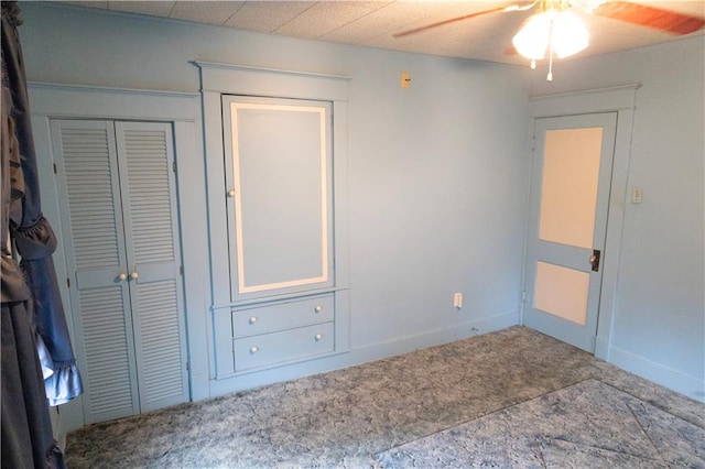 unfurnished bedroom featuring a closet and ceiling fan