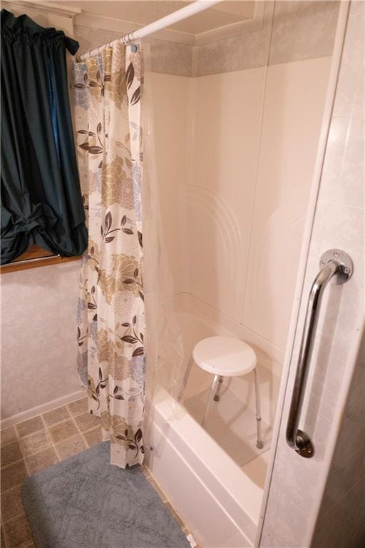 bathroom featuring shower / bathtub combination with curtain