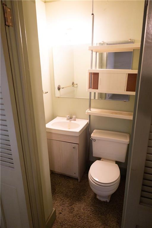 bathroom featuring vanity and toilet