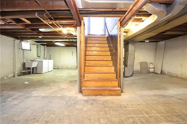 basement with sink and independent washer and dryer