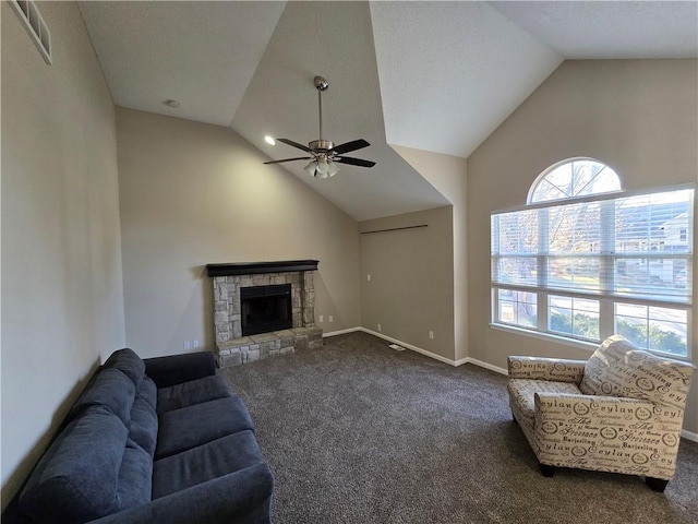 carpeted living room with a fireplace, ceiling fan, and lofted ceiling