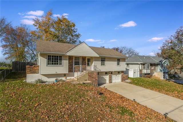 view of front of property with a garage and a front yard