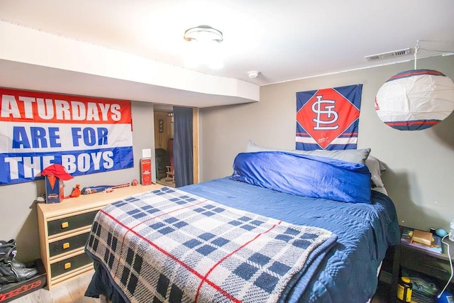 bedroom featuring hardwood / wood-style floors