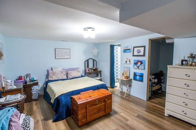 bedroom with light wood-type flooring