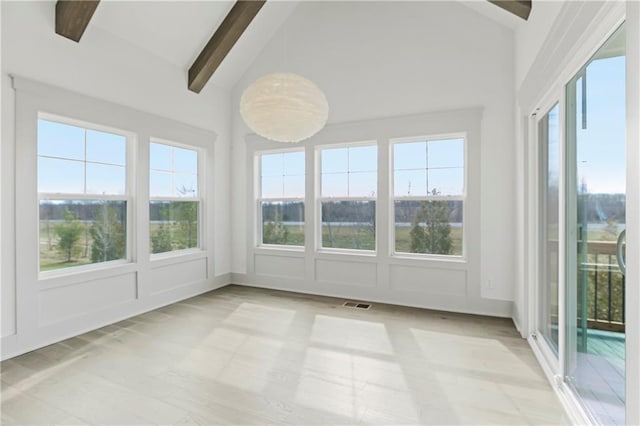 unfurnished sunroom with lofted ceiling with beams, ceiling fan, and visible vents