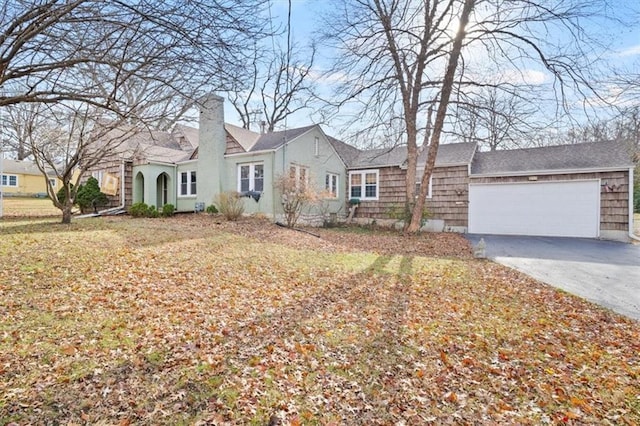 single story home with a front lawn and a garage