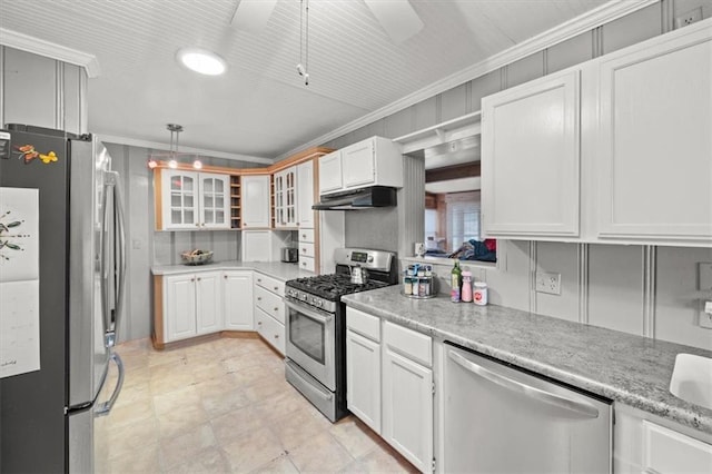 kitchen with pendant lighting, white cabinets, crown molding, ceiling fan, and appliances with stainless steel finishes