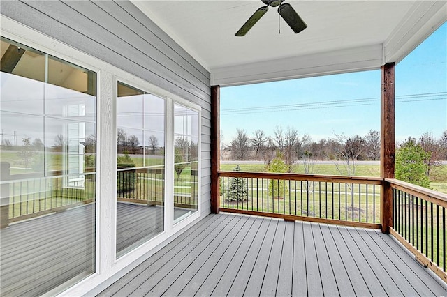 wooden deck with ceiling fan