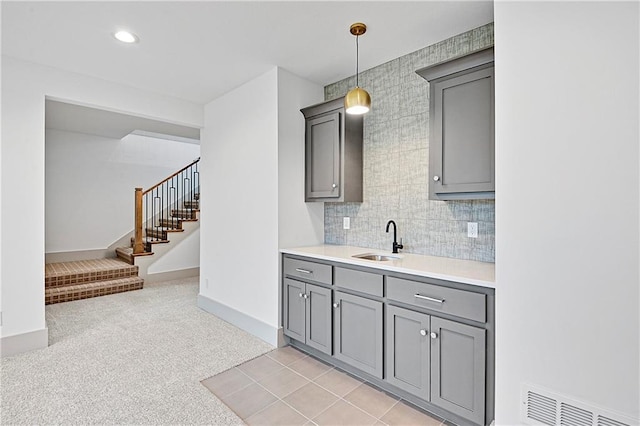 13465 W 174th Pl, Overland Park, KS 66221 - bar with stairway, hanging light fixtures, tasteful backsplash, and light carpet