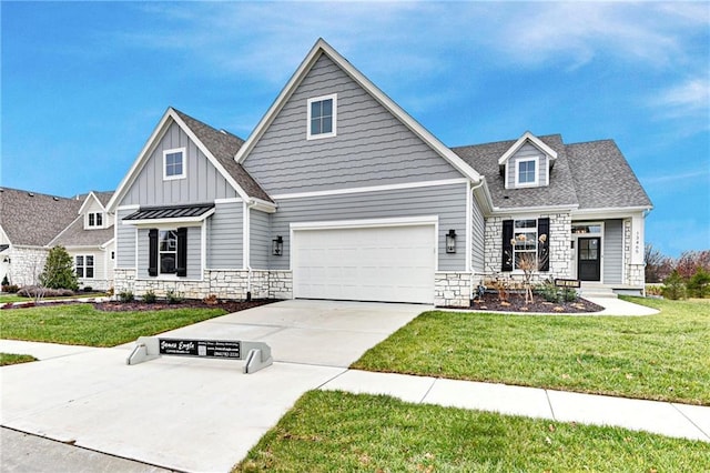 craftsman-style house with a garage and a front lawn