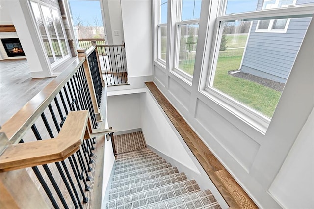 staircase with hardwood / wood-style flooring