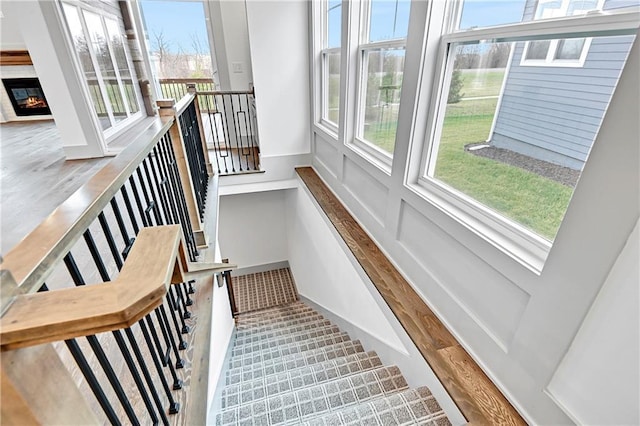13465 W 174th Pl, Overland Park, KS 66221 - staircase featuring a glass covered fireplace
