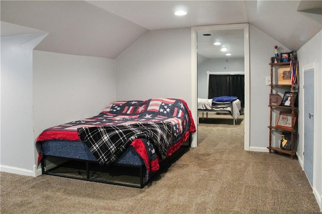 bedroom featuring carpet floors and lofted ceiling