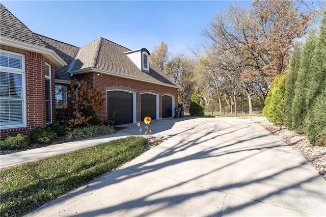 view of side of home featuring a garage