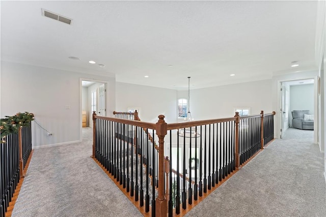 hall featuring light colored carpet