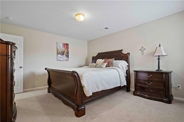 bedroom featuring light colored carpet