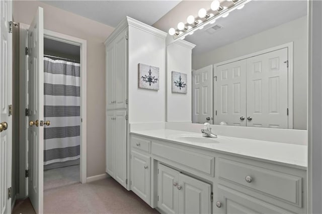 bathroom with a shower with curtain and vanity