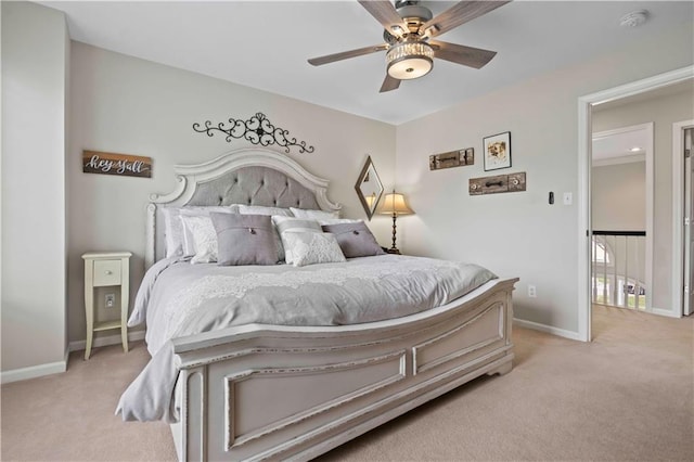 bedroom featuring ceiling fan and light colored carpet