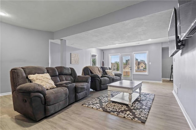 living room with light hardwood / wood-style floors