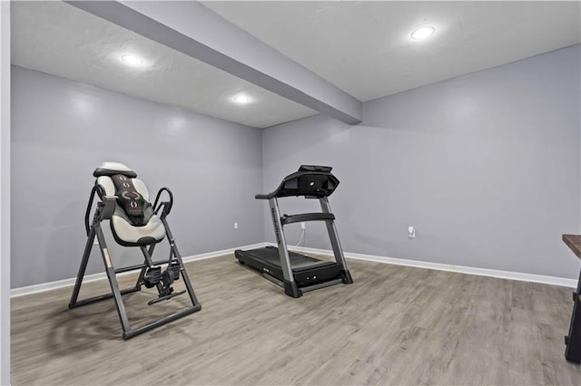 workout area featuring light wood-type flooring