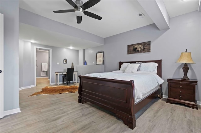 bedroom with ceiling fan and light hardwood / wood-style flooring