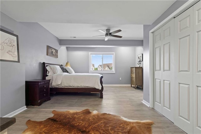 bedroom with ceiling fan and light wood-type flooring