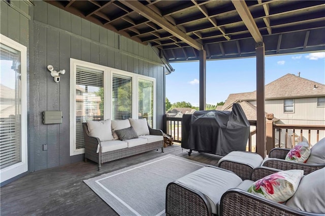 sunroom / solarium featuring a healthy amount of sunlight and vaulted ceiling