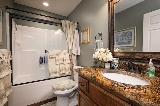 full bathroom with toilet, vanity, and shower / tub combo with curtain