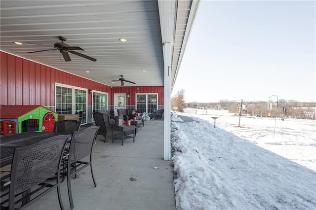 snow covered patio with ceiling fan