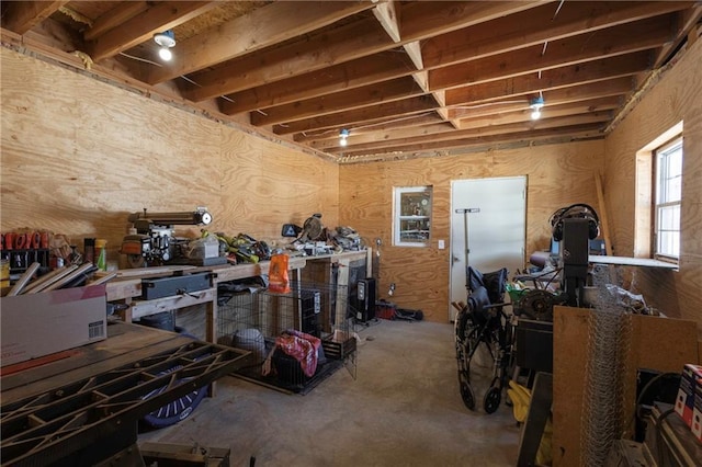 interior space with concrete flooring and a workshop area