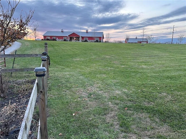 yard at dusk with a rural view