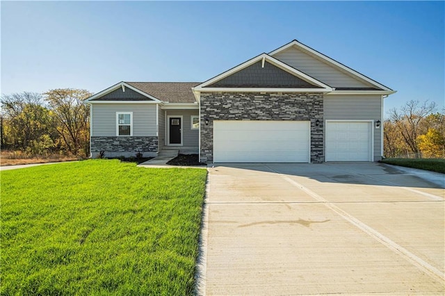 craftsman-style house featuring a front yard and a garage