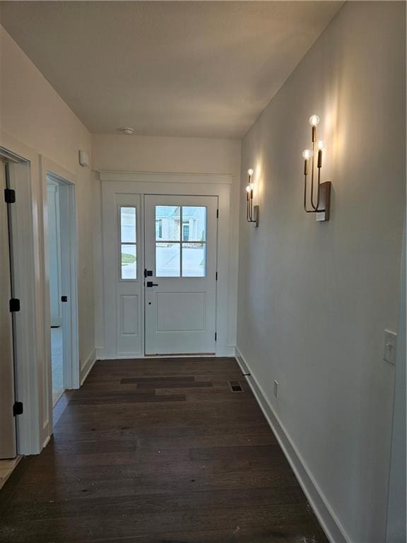 entryway with dark wood-type flooring