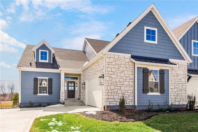 view of front of house with a shingled roof, board and batten siding, a standing seam roof, metal roof, and a garage