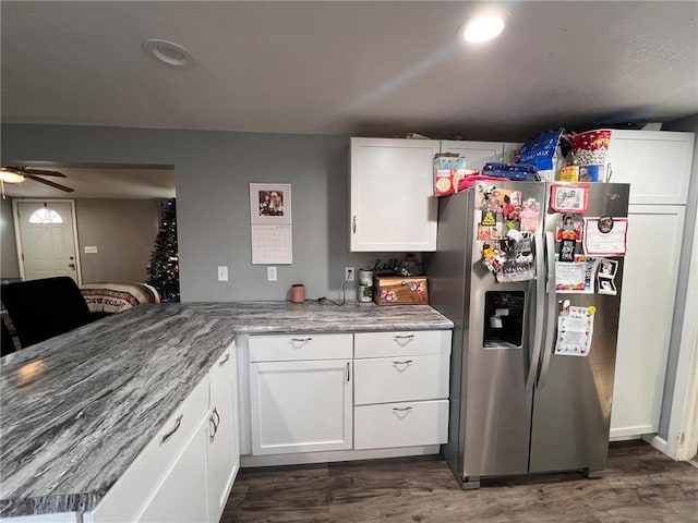 kitchen featuring white cabinetry, ceiling fan, stainless steel fridge, and dark wood-type flooring